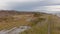 Hiking rail along wetland fields and birch forest on Pakri Peninsula, Paldiski, Estonia