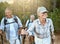 Hiking retired, elderly and senior friends or tourists in forest or mountains for fitness, health and wellness at old