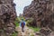 Hiking in rocky canyon, backpacker