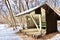 Hiking shelter beside trail in winter