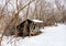 Hiking shelter beside trail in winter