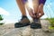 Hiking shoes - woman tying shoe laces