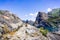 Hiking on the shoreline of Hetch Hetchy reservoir in Yosemite National Park, Sierra Nevada mountains, California; the reservoir is