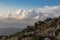 Hiking in the stoned mountains hills during sunset with blue sky and clouds