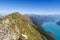 Hiking in the stunning Swiss mountains, view of the alps, green grass, forest swiand footpath