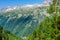 Hiking to Argentiere glacier with the view on the massif des Aiguilles Rouges in French Alps