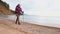 Hiking tourism adventure. Hiker girl lady tourist with backpack walking near lake. Backpacker hiker woman enjoying