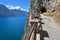 Hiking trail above lake Garda with tunnels and stunning view, old Ponale Road Riva