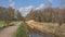 Hiking trail along a draining canal in the Flemish countryside