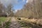 Hiking trail along a draining canal in the Flemish countryside