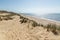 Hiking trail in beautiful dune landscape with beach and ocean in the background on the island of Sylt, Germany