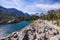 Hiking trail following the shoreline of an alpine lake