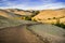 Hiking trail through golden hills at sunset in Garin Dry Creek Pioneer Regional Park