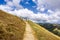 Hiking trail through the hills of south San Francisco bay area; closed cattle gate blocking the trail; San Jose, California