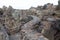 Hiking trail in Los Hervideros. Southwest coast, rugged volcanic landscape, caves and red lava hills. Lanzarote