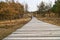 Hiking trail over a wooden walkway to the high dune on the DarÃŸ. National park