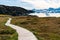 Hiking trail path in Greenland arctic nature landscape with icebergs in Ilulissat icefjord