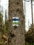 Hiking trail sign on mountains