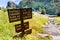 Hiking trail sign posted on the Wapama Falls trail, on the shoreline of Hetch Hetchy reservoir, showing points of interest and