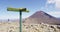 Hiking Trail Signs With Woman Photographing Tongariro National Park New Zealand