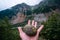 Hiking trail to Chalaadi Glacier in Mestia, Georgia. Summer rainy day. A man\'s hand, a round stone with smooth sides rests