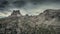 Hiking trail to Cinque Torri at Passo di Falzarego in the Dolomite Alps during cloudy day from above