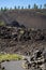 Hiking trail on the Trail of Molten Lands in Newberry Volcanic National Monument in Oregon. Portrait orientation