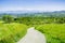 Hiking trail through the verdant hills in spring, view towards south San Francisco bay area, California