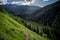 Hiking trail winds up the side of a mountain landscape