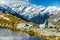 Hiking travel nature hikers in New Zealand mountains. Mount Cook landscape. Couple people walking on Sealy Tarns hike