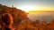 Hiking woman enjoying scenic sunrise from the Path of the Gods between Positano and Praiano on the Amalfi Coast, Campania, Italy