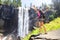 Hiking woman freedom in Yosemite park by waterfall