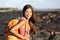 Hiking woman - hiker walking on lava field Hawaii