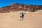 Hiking woman with scenic view on moon landscape of Minas de San Jose Sur near volcano Pico del Teide,  Tenerife.