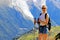 hiking woman smiling in Mont Blanc massif near Chamonix, France