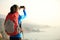 Hiking woman use smart phone taking photo