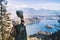 Hiking young woman with alps mountains and alpine lake on background.