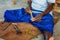 Hikkaduwa, Sri Lanka - 2nd February, 2017: Man is processing branches of cinnamon in small workshop