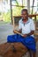 Hikkaduwa, Sri Lanka - 2nd February, 2017: Man is processing branches of cinnamon in small workshop