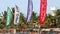 HIKKADUWA, SRI LANKA - FEBRUARY 2014: View of surfing flags on the wind on Hikkaduwa beach. Hikkaduwa is famous for its beautiful