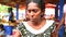 HIKKADUWA, SRI LANKA - MARCH 2014: Portrait of a local young woman selling at Hikkaduwa Sunday market, known for its wide range of