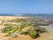 Hikkaduwa, Sri Lanka - March 8, 2022: Beautiful azure water of the Indian Ocean near the coral reef of Hikkaduwa beach. Stones and