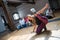 Hilarious young Caucasian dance teacher lifting her leg