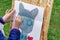 Ð¡hild draws a cat in watercolor. Children`s drawing of a cat
