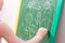 hild draws with chalk on a green blackboard family, happy family