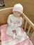 Ð¡hild mannequin sitting in a crib