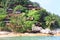 Hill with bungalows on tropical beach