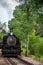 Hill City, South Dakota, USA; 12-2020: Black Hills tourist attraction of an 1880 historic train coming into the station