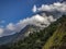 Hill with forest and clouds in the Himalayan area close to Lukla, Nepal