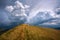 The hill in mountains on background of dramatic sky storm clouds